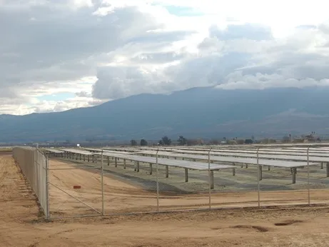 Perimeter fence line and access gate at a California solar farm